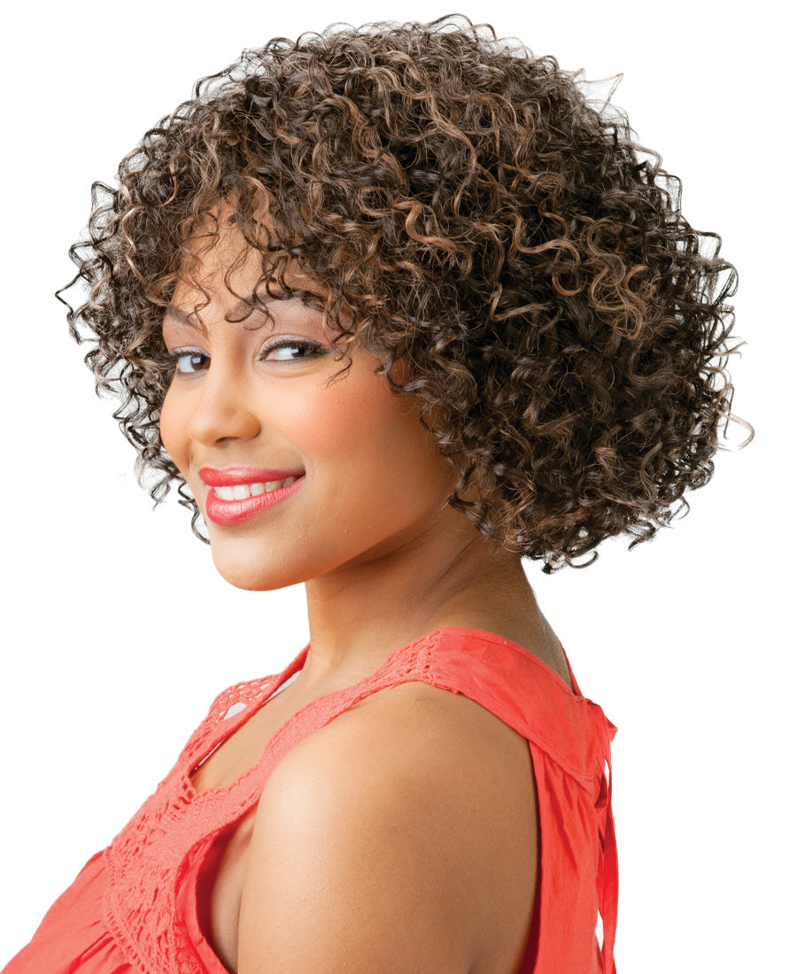 Woman smiling, wearing Cutie 31 Short & Chic synthetic wig with voluminous, chin-length, tight curly dark brown hair with ...