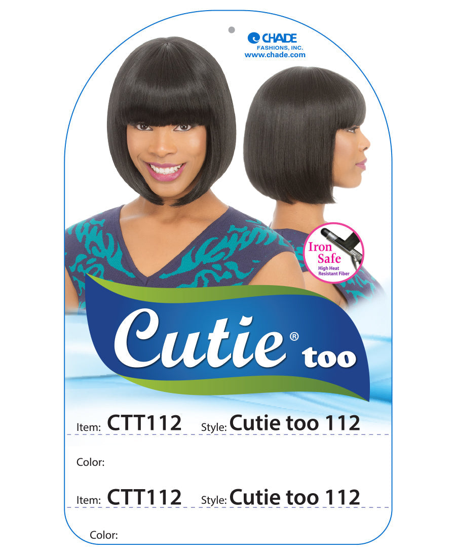 A smiling woman models the New Born Free Cutie Too 112 wig, a sleek chin-length black bob with blunt bangs.