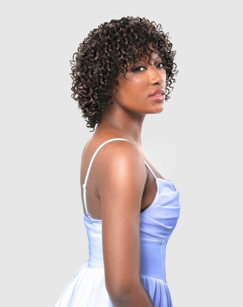 A woman models the HH ZARIA wig: short, dark brown tight curls with bangs, ending above the chin.